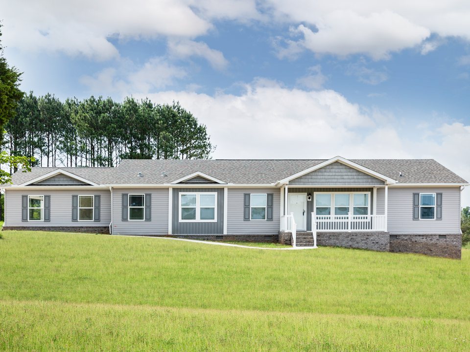 New double-wide manufactured home exterior with covered porch