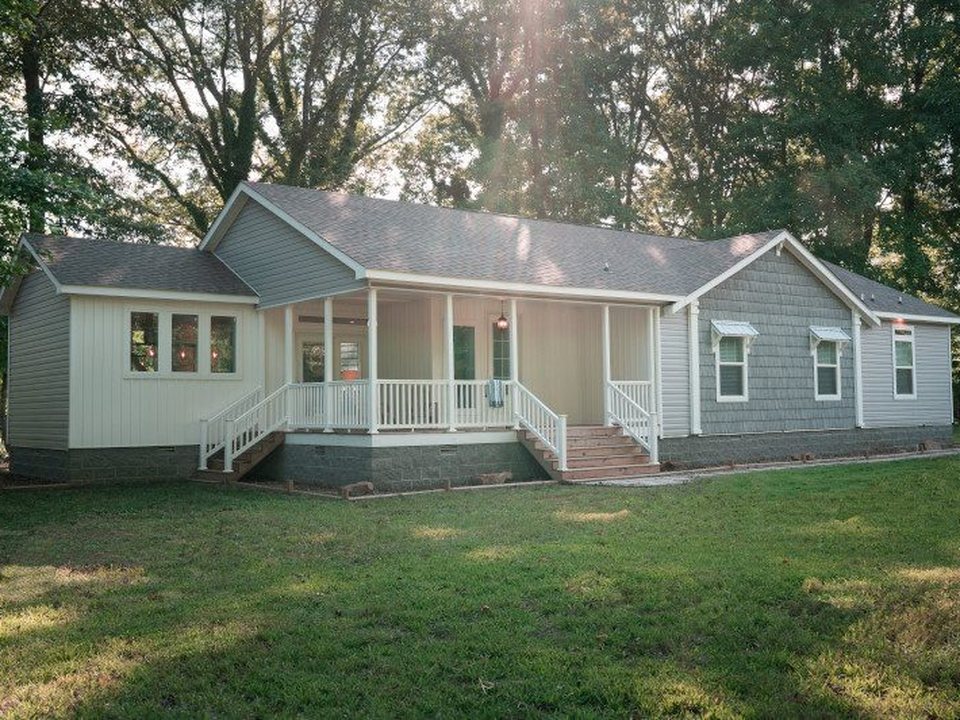 Double-wide manufactured home exterior with front porch
